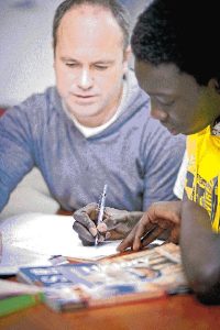 AFL ref kicks goals as refugee mentor