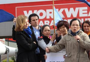 Uniform factory workers left hanging by a thread