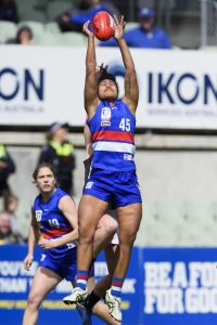 Laloifi kicking goals on the football field