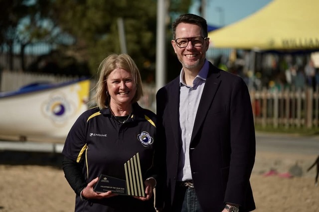 Olympic champ awards champion volunteer